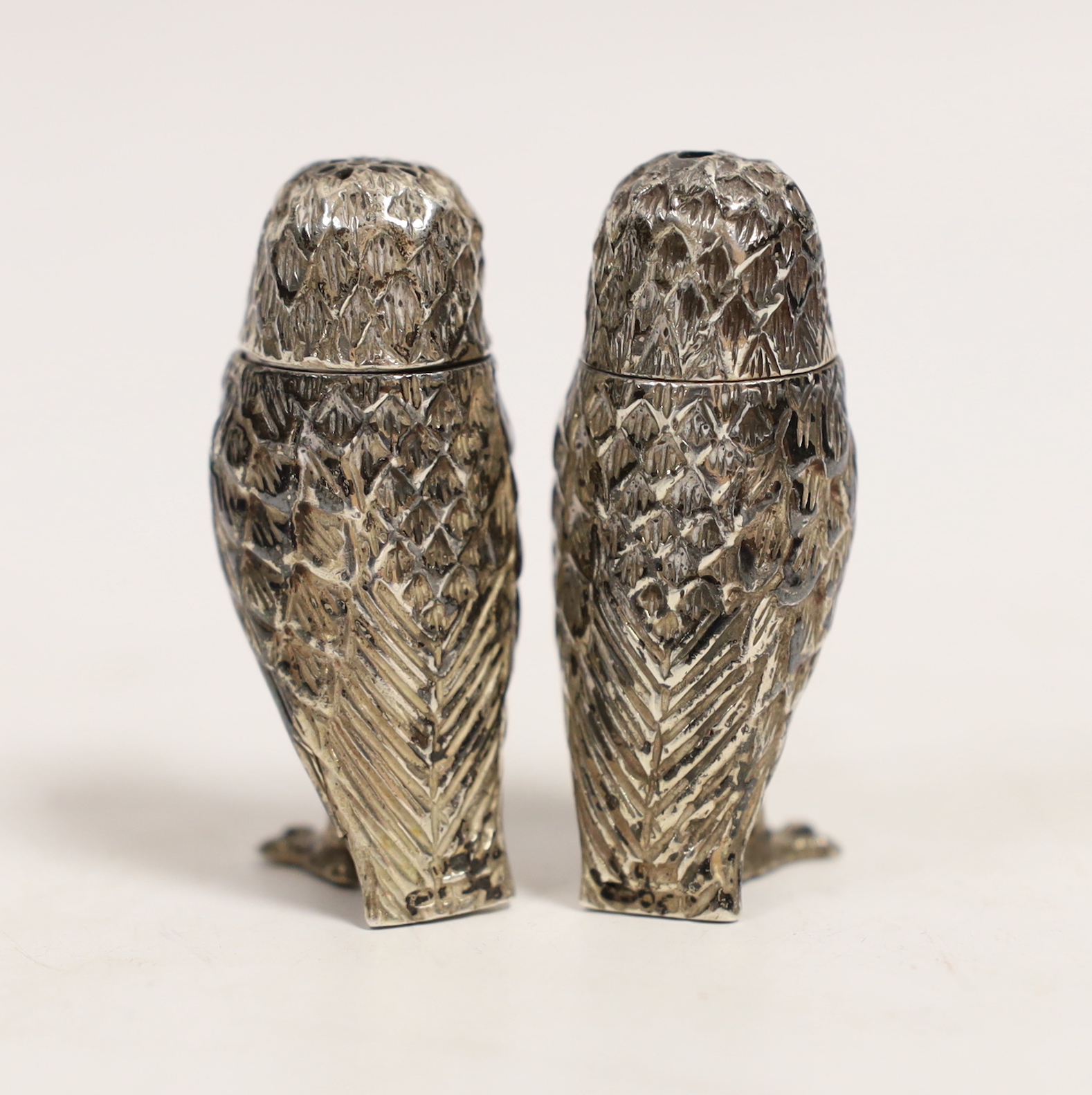 A modern pair of silver owl pepperettes, London, 1997, 53mm.